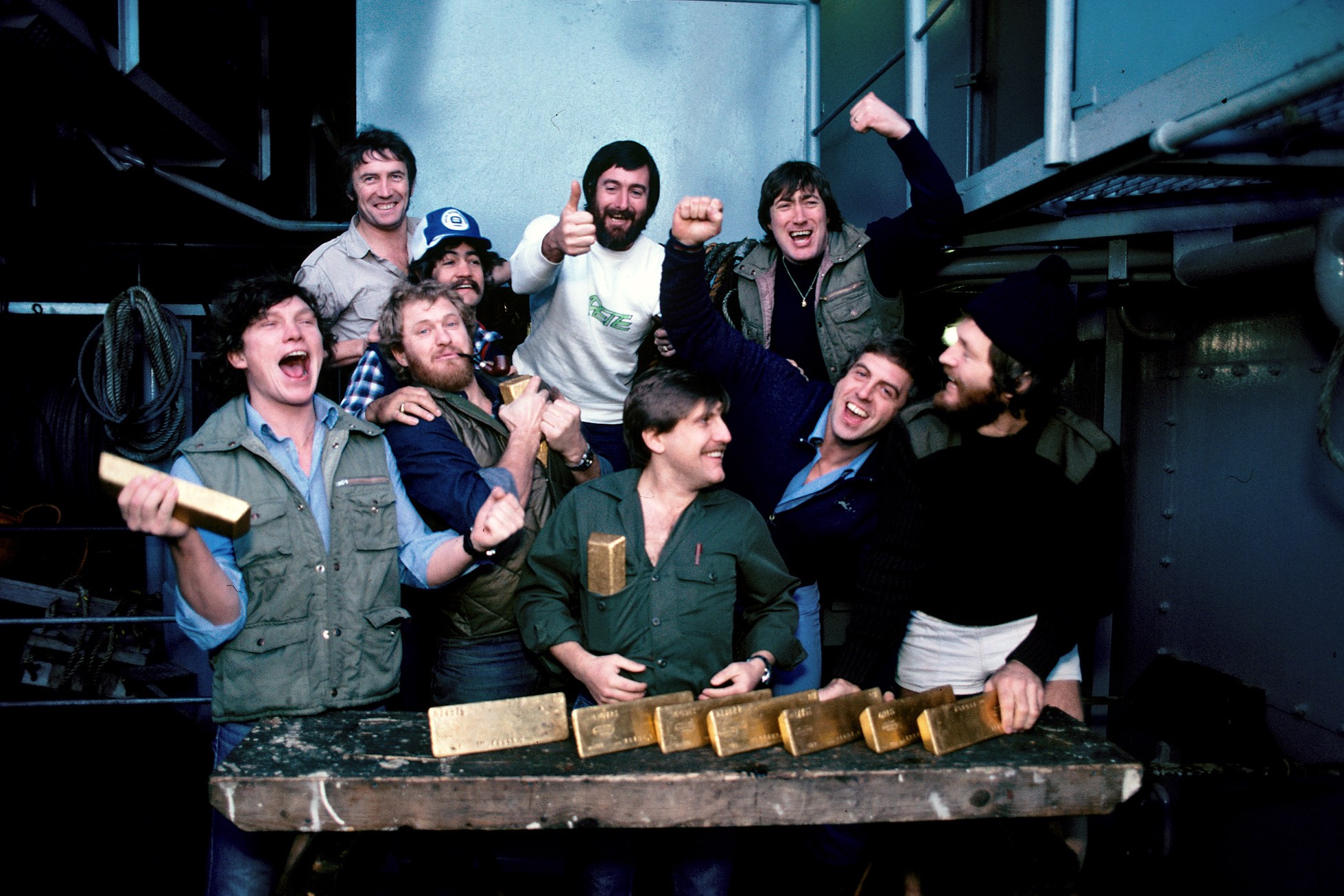 Keith Jessop's salvage crew with gold bars recovered from HMS Edinburgh, 1981