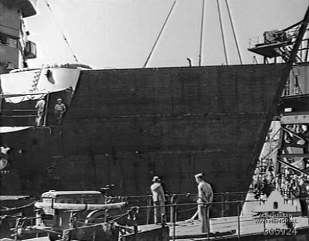 The temporary steel stub bow being fitted to USS New Orleans in Sydney, Australia